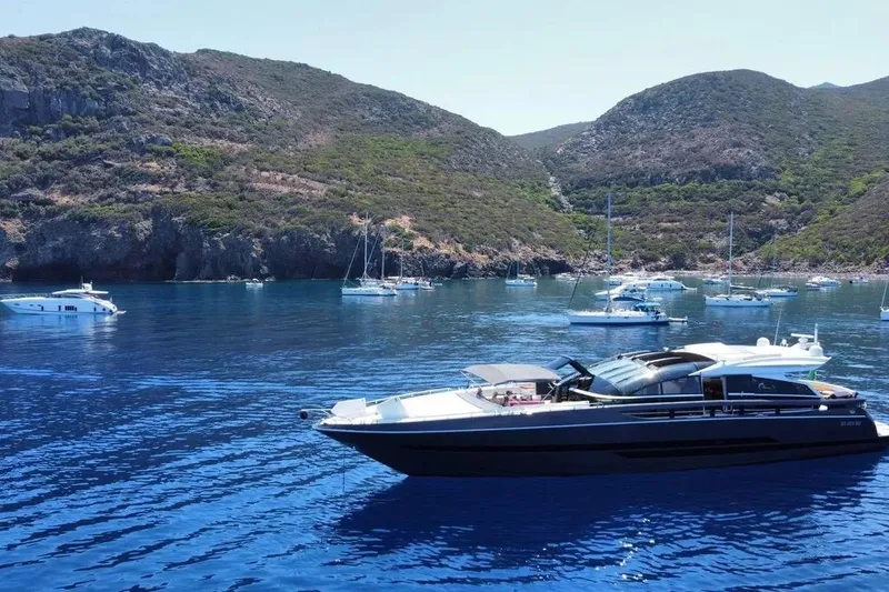 Slide: The Image of Luxurious 2011 Baia ONE HUNDRED yacht cruising in scenic coastal waters. - 105