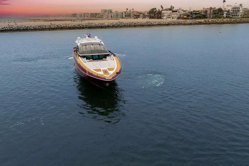 Slide: The Image of Luxury Baia xxx yacht cruising near coastline at sunset, 2011 model. - 11