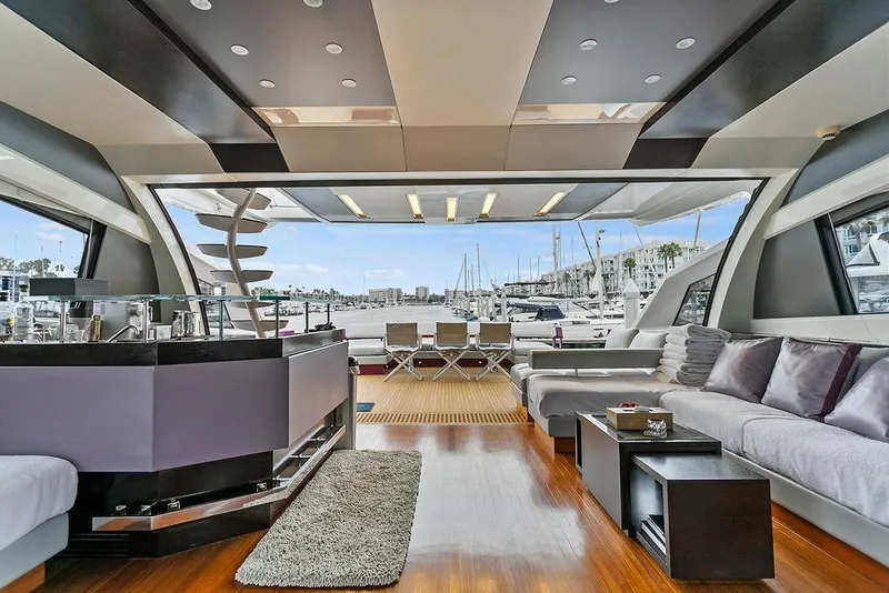 Slide: The Image of Luxurious 2011 Baia yacht interior with modern design, spacious seating, and marina view. - 13