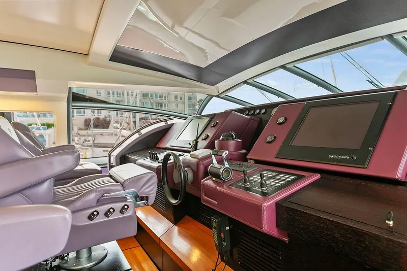 Slide: The Image of Luxurious 2011 Baia yacht cockpit with modern controls and plush seating. - 22