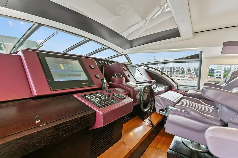 Slide: The Image of Luxurious 2011 Baia xxx yacht cockpit with modern controls and plush seating. - 23