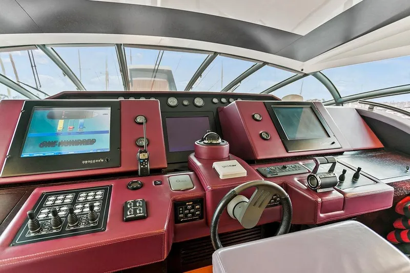Slide: The Image of Cockpit of 2011 Baia xxx yacht with advanced navigation controls and displays. - 26