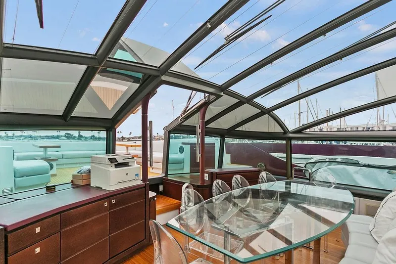 Slide: The Image of Luxurious 2011 Baia yacht interior with glass dining table and panoramic windows. - 29