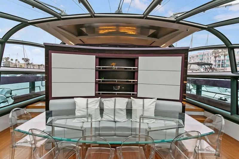 Slide: The Image of Luxurious 2011 Baia yacht interior with modern seating and glass table. - 33