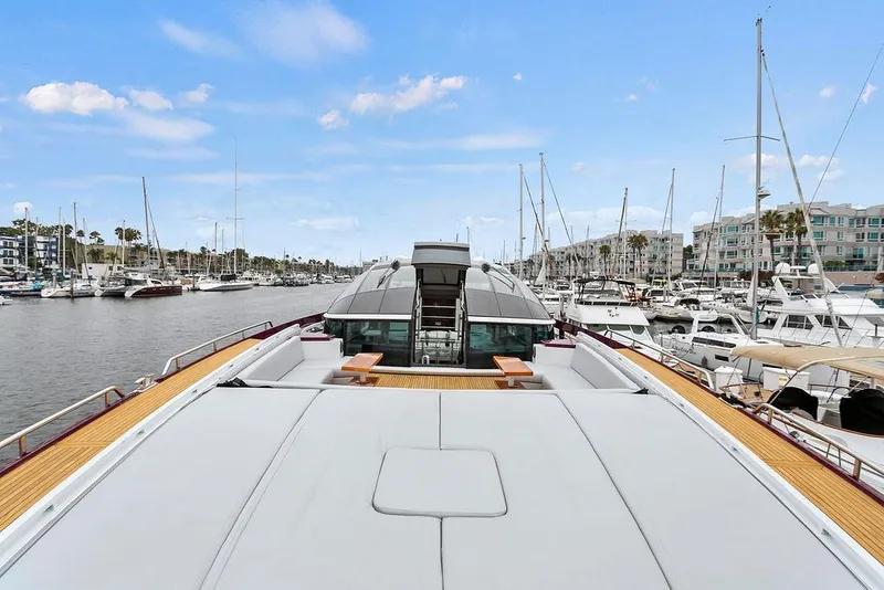 Slide: The Image of Luxurious 2011 Baia yacht docked in a marina, surrounded by other boats. - 35