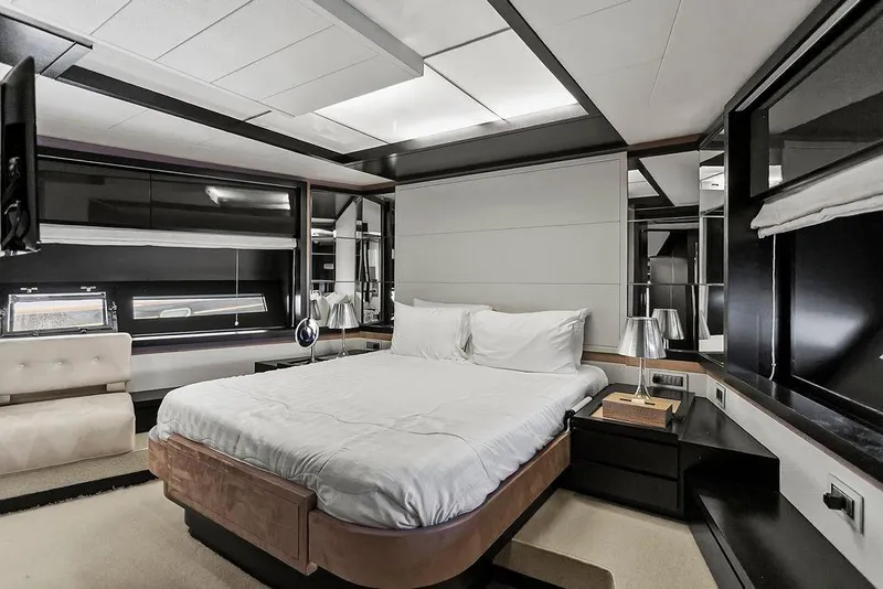 Slide: The Image of Luxurious bedroom interior on a 2011 Baia yacht, featuring modern design and elegant furnishings. - 39