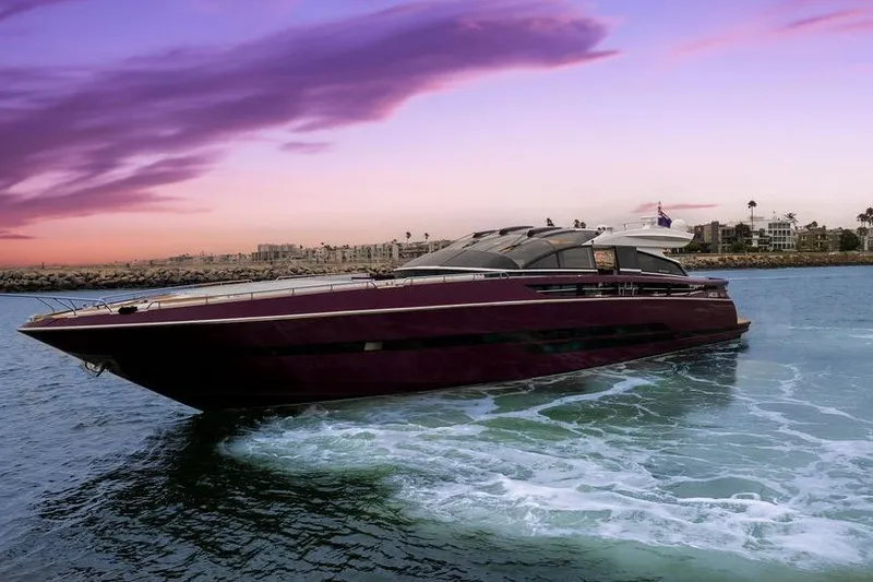 Slide: The Image of Luxurious 2011 Baia xxx yacht cruising at sunset with vibrant sky. - 4