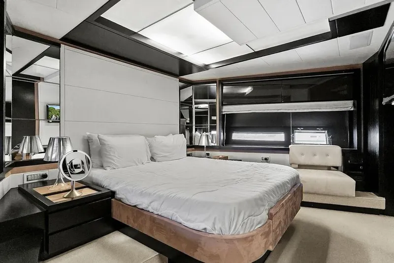 Slide: The Image of Luxurious bedroom interior on a 2011 Baia yacht, featuring modern design and elegant furnishings. - 40