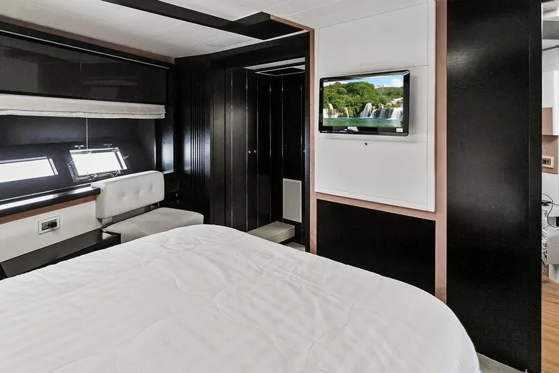Slide: The Image of Luxurious 2011 Baia yacht bedroom with modern decor and wall-mounted TV. - 41