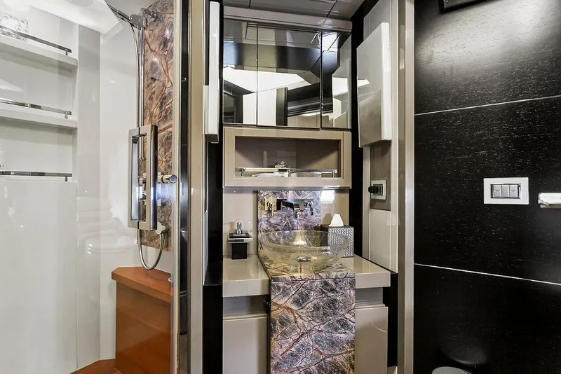 Slide: The Image of Luxurious yacht bathroom with modern fixtures, glass sink, and marble accents, Baia model 2011. - 42