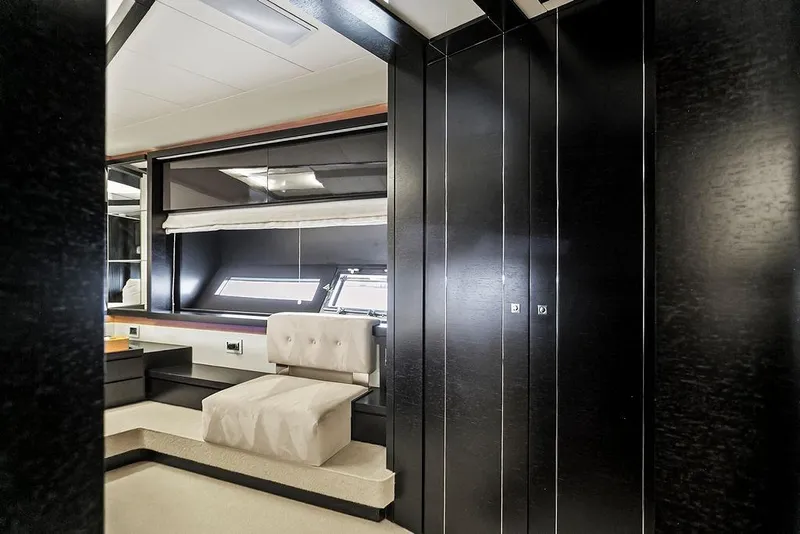 Slide: The Image of Luxurious interior of 2011 Baia xxx yacht with modern black cabinetry and plush seating. - 43