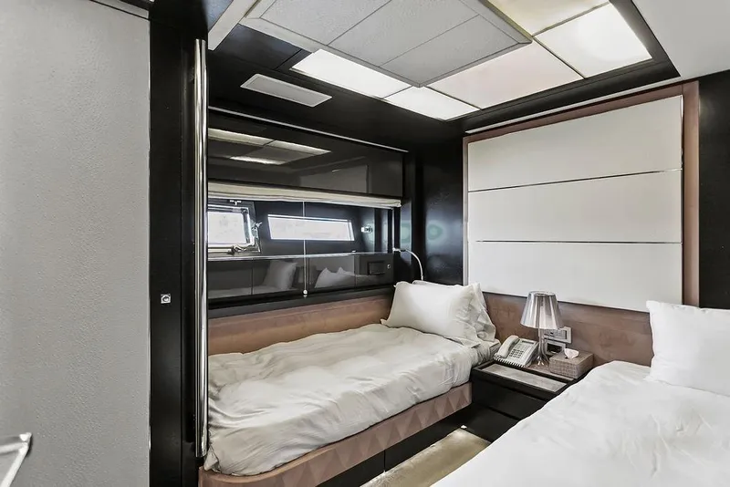 Slide: The Image of Luxurious 2011 Baia yacht cabin with twin beds and modern decor. - 44