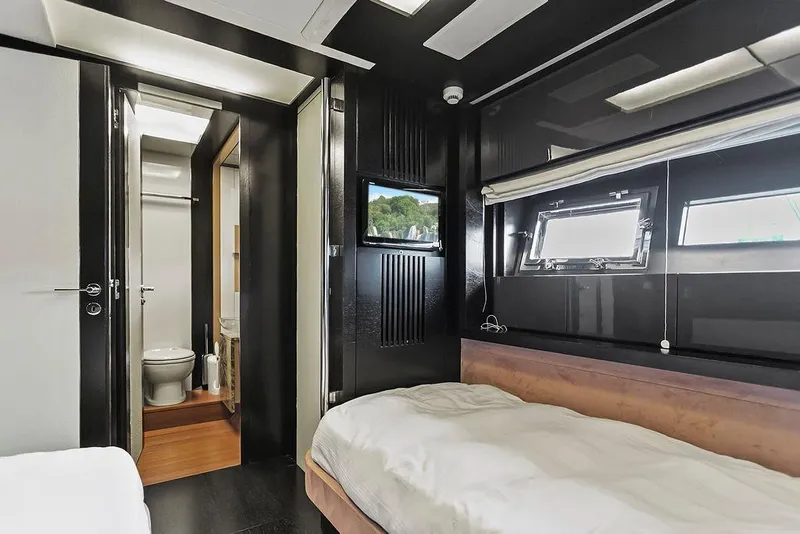 Slide: The Image of Luxurious 2011 Baia yacht interior with modern bedroom and ensuite bathroom. - 45