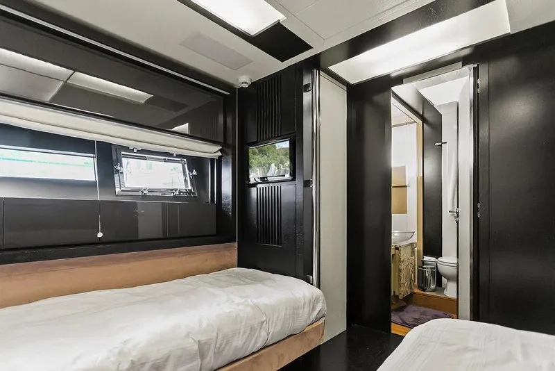 Slide: The Image of Luxurious 2011 Baia yacht interior with twin beds and modern bathroom. - 48