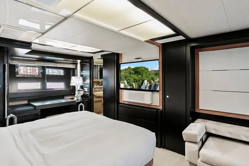 Slide: The Image of Luxurious 2011 Baia yacht interior with modern bedroom, elegant decor, and scenic window view. - 52