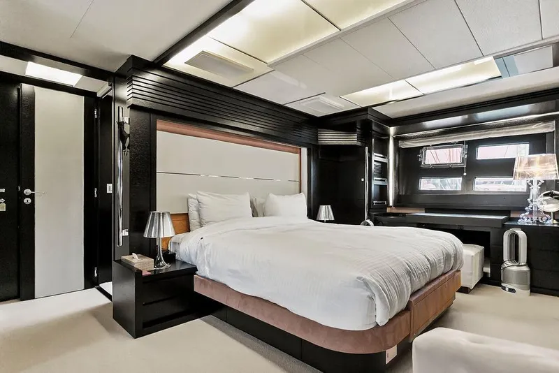 Slide: The Image of Luxurious bedroom interior on 2011 Baia xxx yacht, featuring modern design and elegant furnishings. - 53