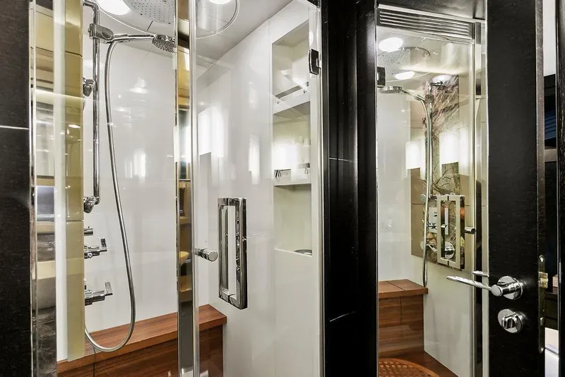 Slide: The Image of Luxurious yacht bathroom with modern shower, sleek design, and wooden accents, Baia xxx 2011 model. - 56