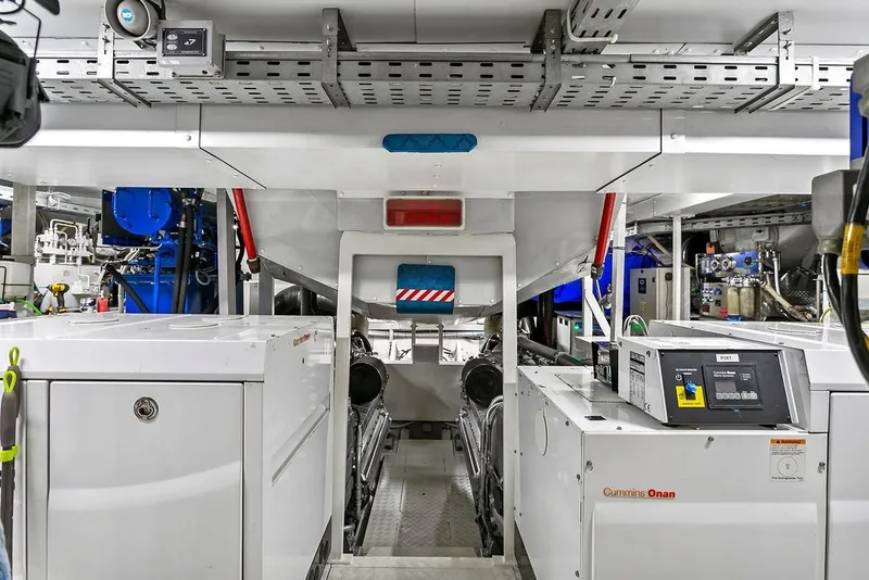 Slide: The Image of Engine room of a 2011 Baia xxx yacht featuring Cummins Onan generator systems. - 57