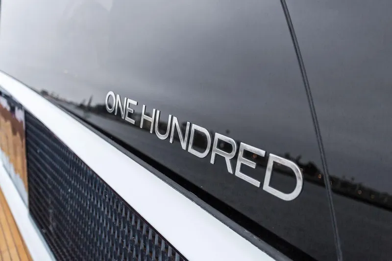 Slide: The Image of Close-up of "One Hundred" lettering on 2011 Baia xxx yacht exterior. - 61