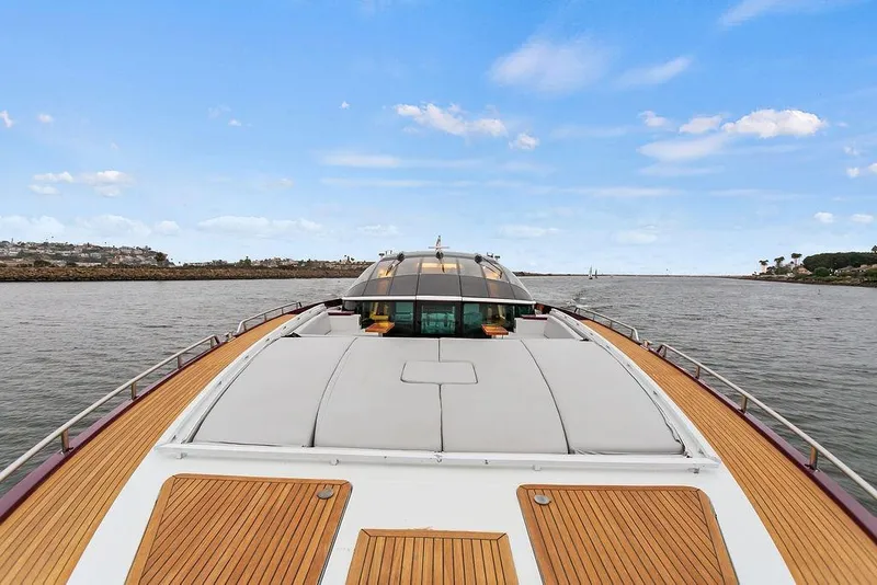 Slide: The Image of Luxurious 2011 Baia yacht with sleek deck design cruising on open water. - 63