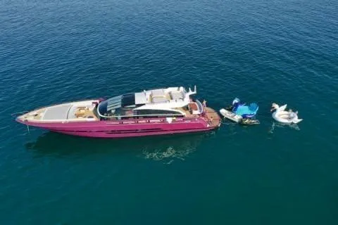 Slide: The Image of Luxurious 2011 Baia ONE HUNDRED yacht on serene blue water with inflatable swan floats. - 68