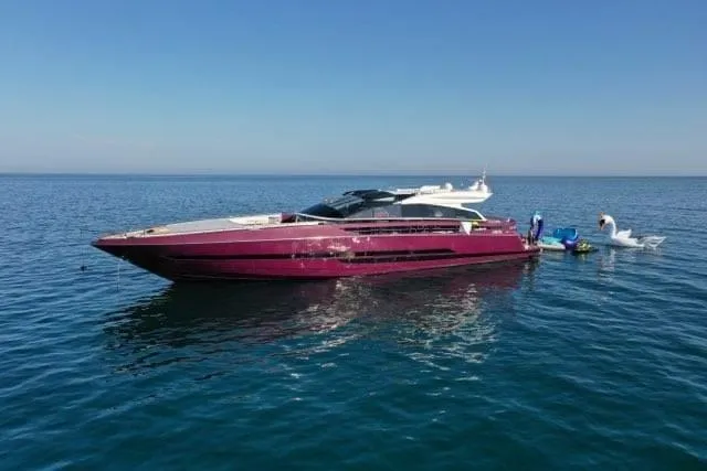 Slide: The Image of Luxurious 2011 Baia ONE HUNDRED yacht on calm blue sea with inflatable swan. - 69