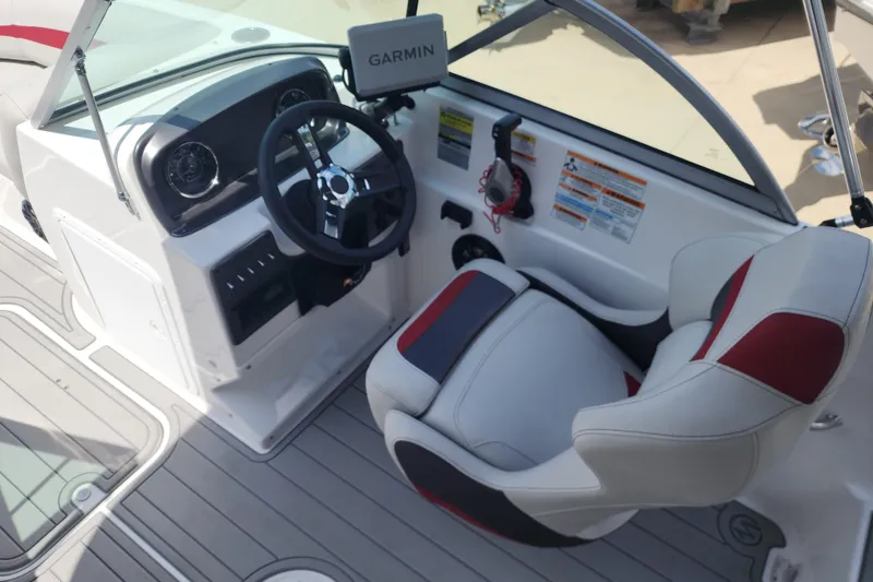 Slide: The Image of 2023 Hurricane SunDeck 187 OB boat cockpit with Garmin navigation and stylish seating. - 10