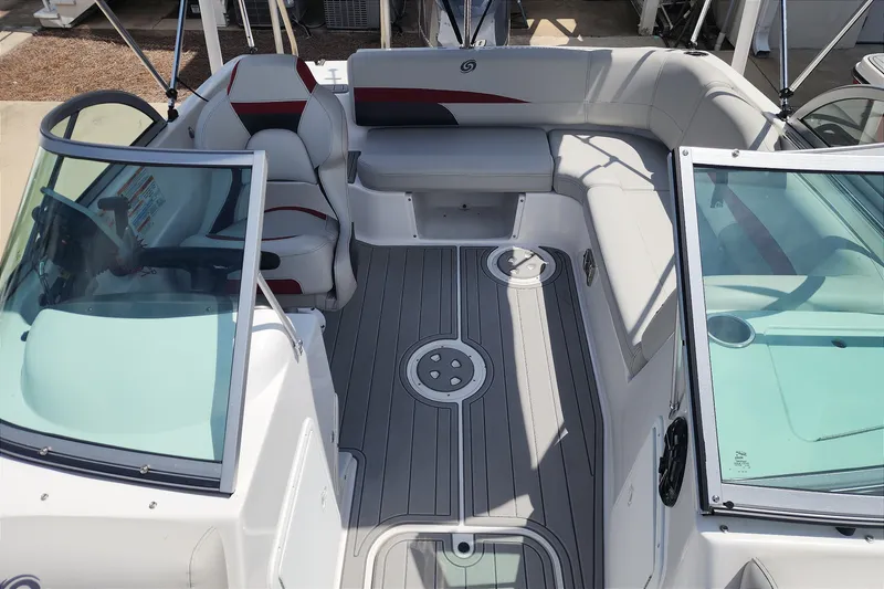 Slide: The Image of 2023 Hurricane SunDeck 187 OB boat interior with spacious seating and modern design. - 11