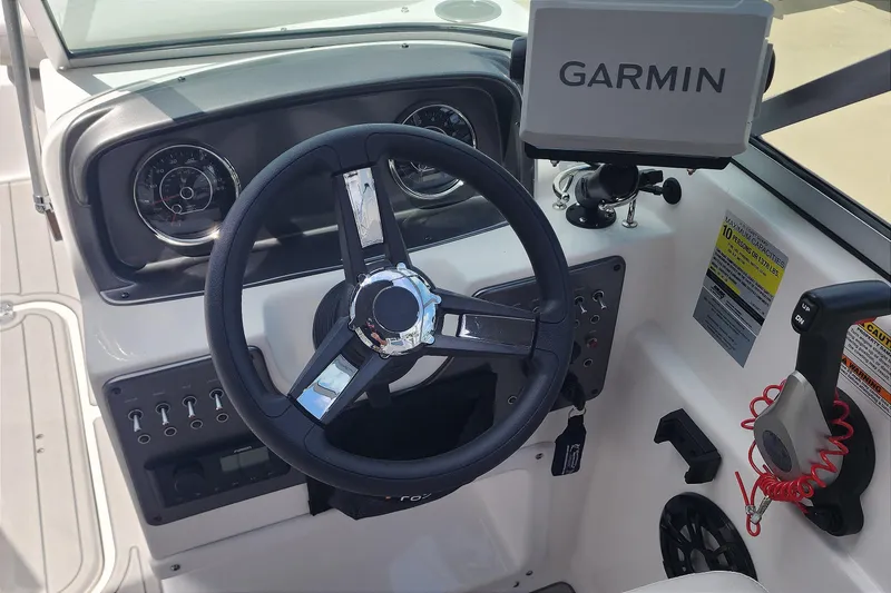 Slide: The Image of 2023 Hurricane SunDeck 187 OB boat dashboard with Garmin navigation system. - 6