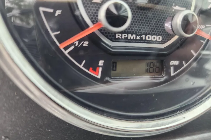 Slide: The Image of Close-up of 2023 Hurricane SunDeck 187 OB fuel gauge and RPM meter. - 9