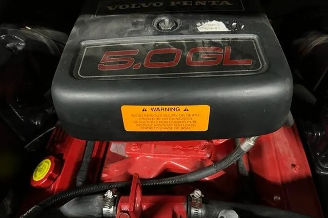 Slide: The Image of Volvo Penta 5.0 GL engine in 2003 Chaparral 210 SS boat, featuring warning label. - 5
