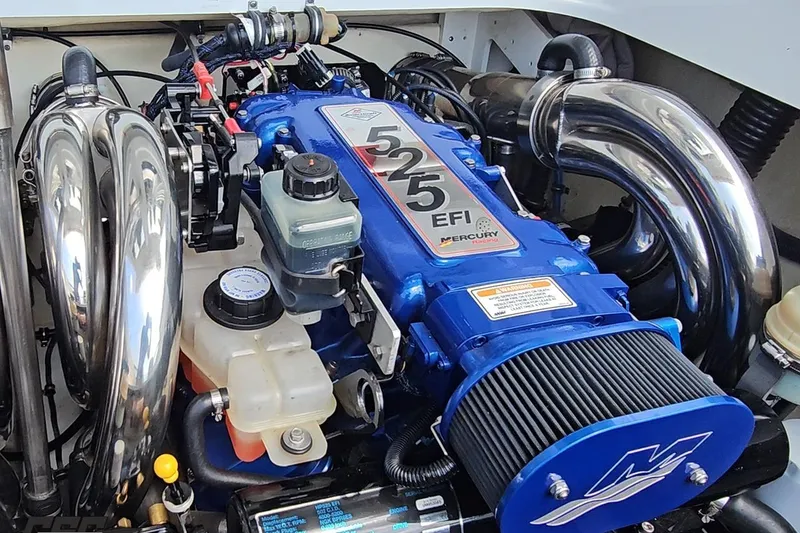 Slide: The Image of 2005 Formula 353 FASTech engine with Mercury Racing 525 EFI, featuring chrome exhaust headers. - 100