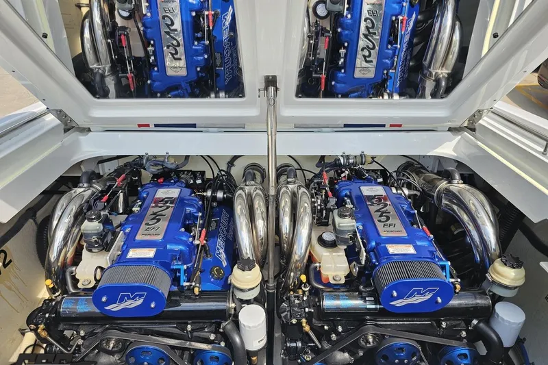 Slide: The Image of Twin Mercury engines in a 2005 Formula 353 FASTech boat, showcasing powerful performance. - 101