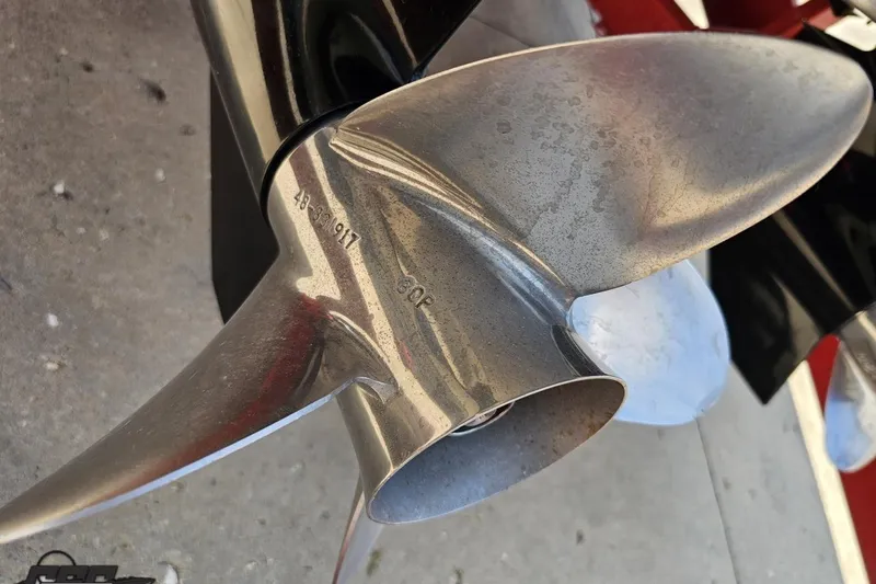 Slide: The Image of Close-up of a 2005 Formula 353 FASTech boat propeller, showcasing its metallic blades. - 102