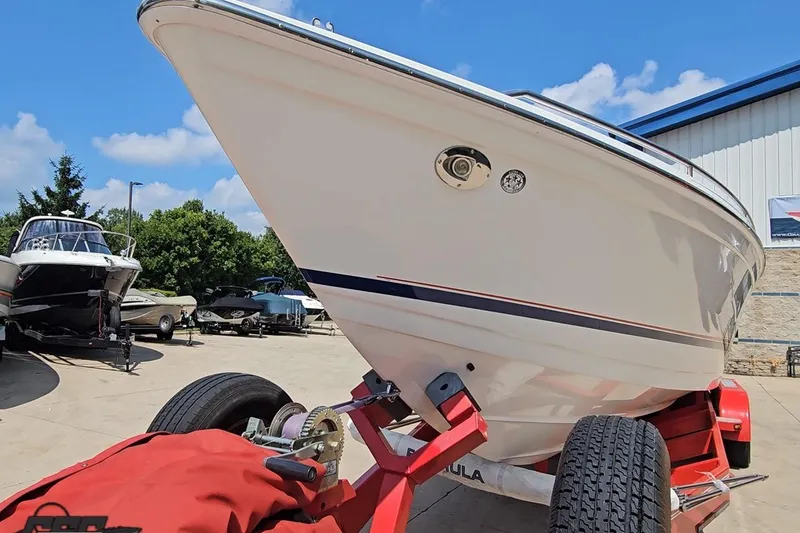 Slide: The Image of 2005 Formula 353 FASTech boat on trailer in sunny outdoor setting. - 14