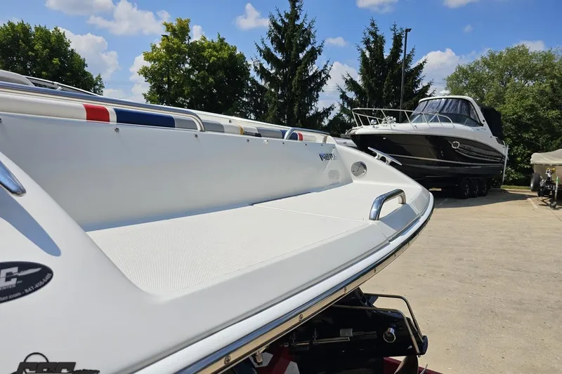Slide: The Image of 2005 Formula 353 FASTech boat on trailer, sunny day, trees in background. - 28