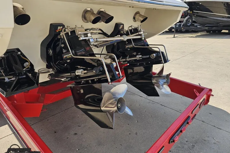 Slide: The Image of 2005 Formula 353 FASTech boat with dual Mercury outdrives on a red trailer. - 29