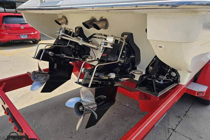 Slide: The Image of 2005 Formula 353 FASTech boat on red trailer, featuring dual propellers and outboard motors. - 34