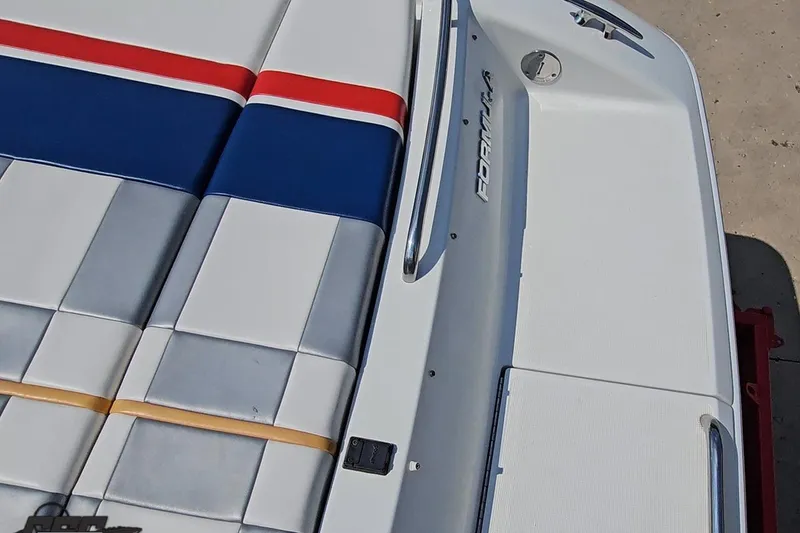Slide: The Image of 2005 Formula 353 FASTech boat with colorful cushioned seating and sleek design. - 37
