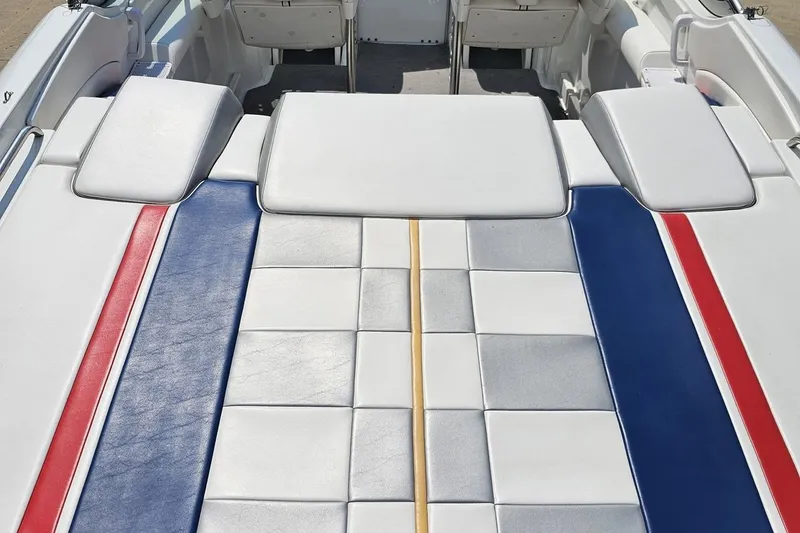 Slide: The Image of 2005 Formula 353 FASTech boat interior with red, blue, and white cushioned seating. - 38