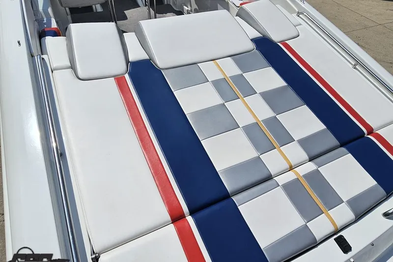 Slide: The Image of 2005 Formula 353 FASTech boat with colorful, checkered upholstery design on deck. - 43