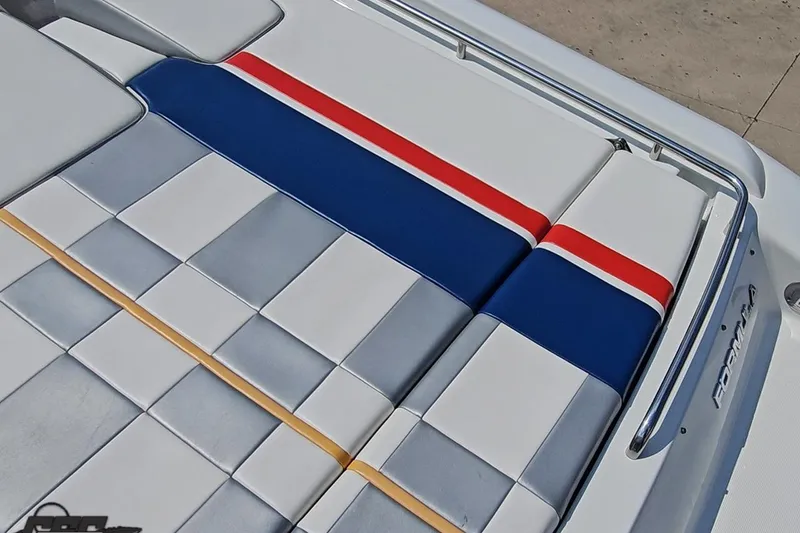Slide: The Image of 2005 Formula 353 FASTech boat seating with red, blue, and white upholstery. - 44