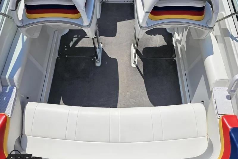 Slide: The Image of 2005 Formula 353 FASTech boat interior with white seating and colorful accents. - 48