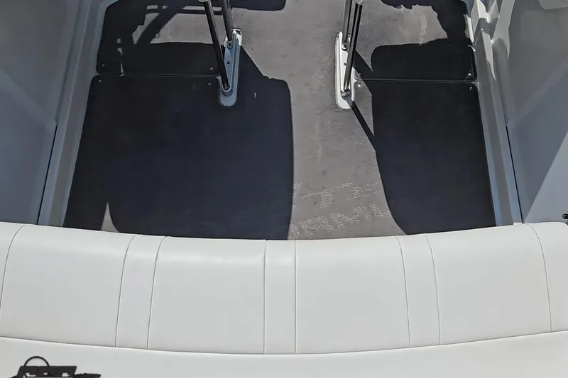 Slide: The Image of 2005 Formula 353 FASTech boat interior with white seating and gray flooring. - 49