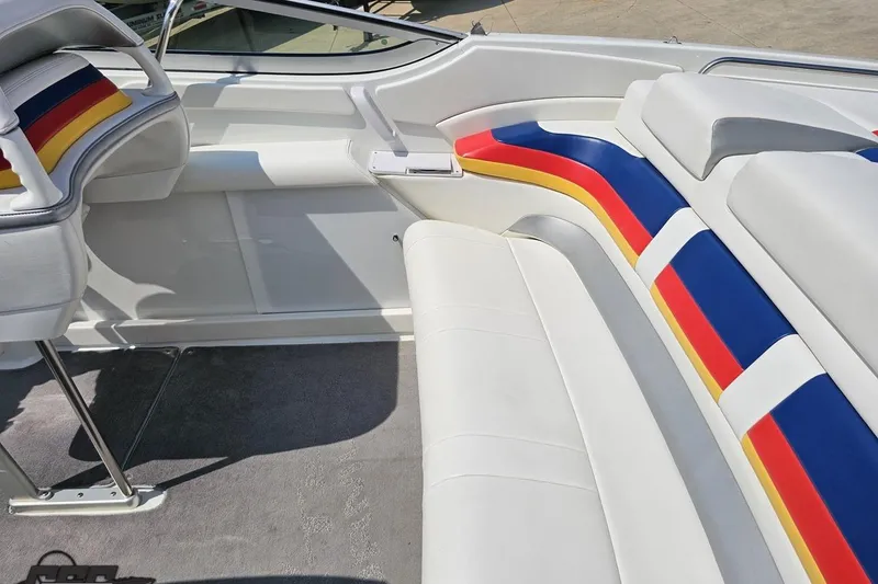 Slide: The Image of 2005 Formula 353 FASTech boat interior with colorful striped seating. - 50