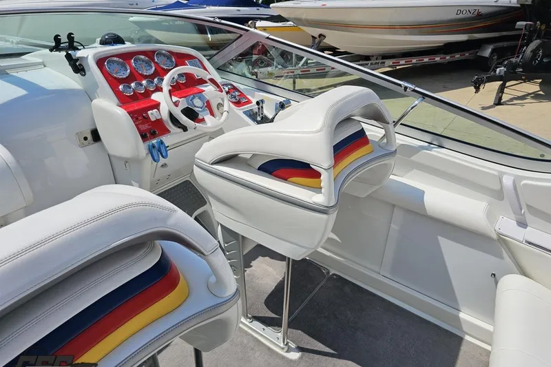 Slide: The Image of 2005 Formula 353 FASTech boat interior with colorful seats and red dashboard. - 52