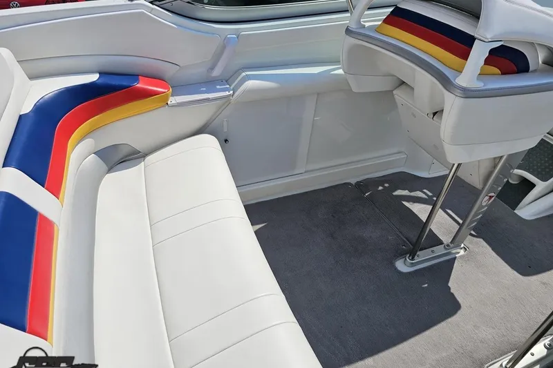 Slide: The Image of 2005 Formula 353 FASTech boat interior with colorful seating and sleek design. - 54