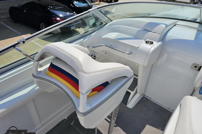 Slide: The Image of 2005 Formula 353 FASTech boat interior with white seating and colorful accents. - 56