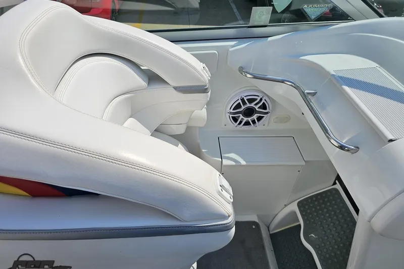 Slide: The Image of 2005 Formula 353 FASTech boat interior with white seating and speaker detail. - 57