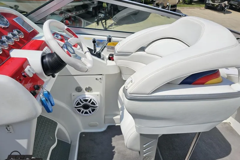 Slide: The Image of 2005 Formula 353 FASTech boat interior with white seats and red dashboard. - 61